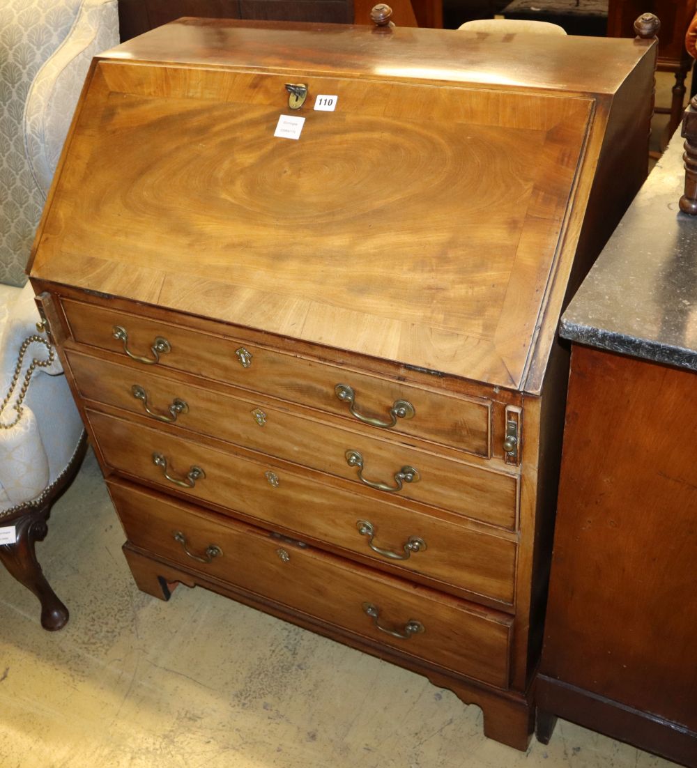 A George III mahogany bureau fitted four long drawers on bracket feet, W.86cm